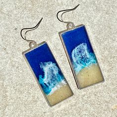 "These realistic beach earrings and necklace are made with layers of resin, bright colorful inks and real sand. These earrings are 43mm x 19mm. The pendant is on an 18\" chain. These are made to order and yours may be slightly different than those pictured."