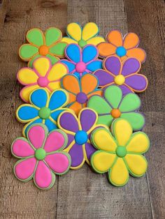 decorated cookies are arranged in the shape of flowers