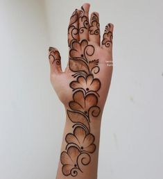 a woman's hand with an intricate design on it