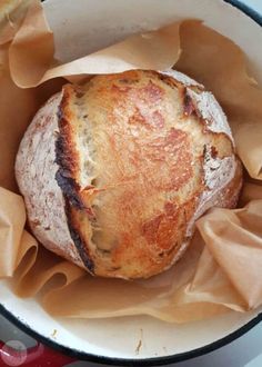 a loaf of bread sitting inside of a pan