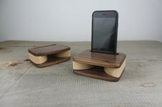 two wooden cell phones stand on top of each other