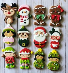 christmas cookies are arranged in the shape of santa claus, snowman, elf and other characters