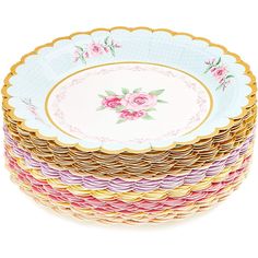 a stack of plates with pink flowers on them