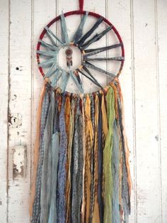 an image of a dream catcher hanging on a wall with the words dream catcher written below it