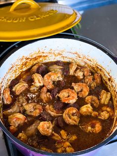 a pot filled with food sitting on top of a stove