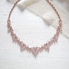 Our lovely rose gold bridal necklace is the perfect accent to your wedding gown with it's romantic vintage inspired design.   - Crafted with Premium Cubic Zirconia stones - Necklace measures 17 inches. - Available in rose gold, yellow gold and rhodium finish - Nickel free and hypoallergenic - READY TO SHIP ** if you would like to add a backdrop click here: https://www.etsy.com/listing/601882345/bridal-backdrop-back-drop-addition-add-a?ref=shop_home_active_20&crt=1 This is an original design by © Rose Gold Choker Necklace, Bridal Backdrop, Bridal Backdrops, Rose Gold Wedding Jewelry, Gold Bridal Necklace, Backdrops Necklace, Layered Choker Necklace, Rose Gold Earrings Studs, Gold Wedding Jewelry