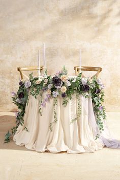 the table is covered with flowers and candles for an elegant touch to the wedding ceremony