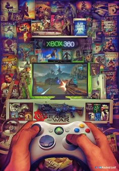 a person holding a video game controller in front of a wall covered with pictures and games