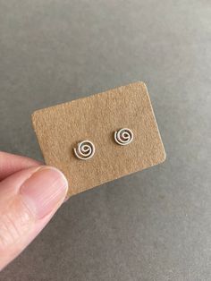 Silver Swirl Stud Earrings - Sterling Silve Color : Silver Materials : Sterling Silver  Size : 7mm Quantity: One Pair * Metal components are Sterling Silver including earring backs. * Suitable for delicate and sensitive ears. * Comes in a jewelry box. If you need extra boxes for gifting....just let us know! Silver Spiral Cartilage Earrings As Gift, Minimalist Spiral Earrings For Gifts, Minimalist Spiral Earrings As Gift, Hypoallergenic Spiral Earrings For Everyday, Swirl-shaped Pierced Earrings For Gift, Minimalist Silver Swirl Earrings, Minimalist Swirl Earrings Gift, Minimalist Swirl Earrings As Gift, Minimalist Spiral Hypoallergenic Earrings