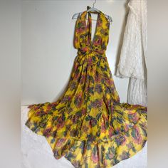 Misa Los Angeles Halter Neck Grand Canary Print Ruffled Hem Made In The Usa Dry Clean 100% Poly Chiffon Measurements Bust:Fits 30-34” Waist:28” Length :51” From Pit S-Br Elegant Flowy Yellow Dress, Elegant Yellow Flowy Dress, Yellow Ruffled Maxi Dress For Party, Yellow Ruffles Maxi Dress For Party, Chic Yellow Maxi Dress With Ruffles, Elegant Yellow Beach Dress, Chic Mustard Maxi Dress For Party, Yellow V-neck Maxi Dress For Garden Party, Elegant Flowy Yellow Maxi Dress