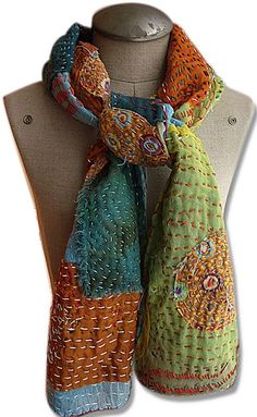 a mannequin wearing a multicolored scarf