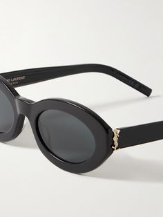 Find SAINT LAURENT Oval-frame Acetate Sunglasses on Editorialist. SAINT LAURENT Eyewear's sunglasses have chunky oval-shaped frames that give them a cool, retro vibe. They've been made in Italy from black acetate and feature a hinged, tiny version of the iconic 'YSL' plaque at the temples. Ysl Sunglasses, Flamboyant Natural, Acetate Sunglasses, Oval Sunglasses, Oval Frame, Retro Vibe, Eyewear Sunglasses, Sunnies, Saint Laurent