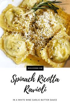 spinach ricotta ravioli in white wine garlic butter sauce with rosemary sprinkled on top