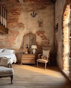 a bedroom with brick walls and furniture in the corner, along with an arched doorway leading to another room