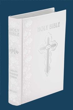 a white book with a cross on it