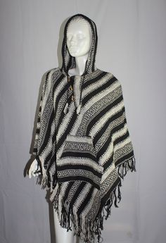 100% Cotton Made in Nepal  Suitable for Vegans Warm fashionable ponchos with hood and pockets for Winter Length approx 80cm from shoulder to the triangle point on bottom Width approx 100cm  Weight approx 1kg Buttons to adjust. THANKYOU FOR STOPPING BY Oversized Hippie Poncho For Winter, Bohemian Hooded Poncho One Size, Hippie Style Poncho For Festivals, One Size, Bohemian Hooded Brown Poncho, Bohemian Hooded Alpaca Poncho, Poncho Hoodie, Winter Poncho, The Triangle, Jan 1