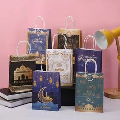 there are many bags that have different designs on them, and one has a lamp in the middle