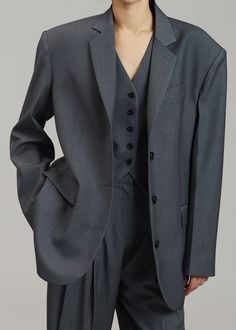 Color: Dark Grey Melange Midweight traditional suiting fabric Oversized tailored silhouette Padded shoulders Button front closure Flap front pockets Lined 65% Lyocell 25% Rayon 10% Wool Dry Clean By The Frankie Shop. Imported Dark Grey Suit Women, Grey Suits For Women, Dark Grey Clothes, Oversized Suit Women, Dark Gray Outfit, Aesthetic Suits, Suits Aesthetic, Suit Aesthetic, Dark Grey Dress