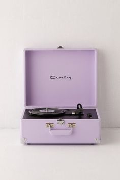 a purple suitcase with a record player in it