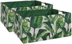 three storage bins with green leaves on them