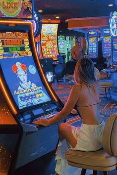 a woman sitting in front of a slot machine