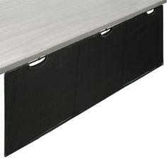 a white table with two black bins on it's sides and one is empty