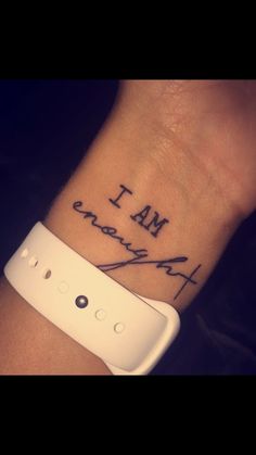 a wrist tattoo with the words i am awesome written on it, and an image of a video game controller