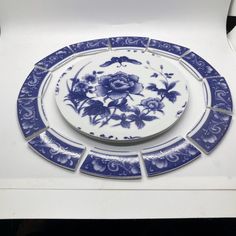 a blue and white plate with flowers on it