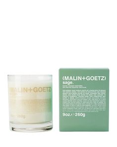 a candle that is next to a box on a white background with the words main - goetz