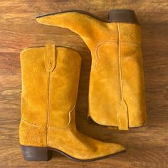 Acme Vintage Suede Mustard Yellow Colored Cowboy Western Boot. Some Minor Marks At Suede, Normal Wear At Soles. Recently Had New Heels Put On Them. Some Wear At Footbed, Could Use A Dusting. 1.4” Heel. 9.75” Shaft. Top Circumference 12.5” Around. Womens Size 6.5. A Shoe Width Which Is Slightly More Narrow. Suede Cowboy Boots, New Heels, Vintage Suede, 2024 Trends, Western Boot, Cowboy Western, Western Cowboy Boots, Mustard Yellow, Red Yellow