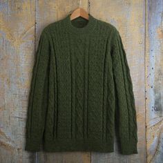 Artisan Wilber Calapuja and his workshop specialize in classic alpaca wool sweaters such as this moss green pullover for men. Calapuja combined his technical training with his memories of his mother's knitting to establish his own workshop after many years of work. Old Man Sweater Outfit, Green Sweater Men, Wool Sweater Outfit, Green Wool Sweater, Mens Green Sweater, Green Oversized Sweater, Sweater Outfits Men, Quilted Sweater, Alpaca Wool Sweater