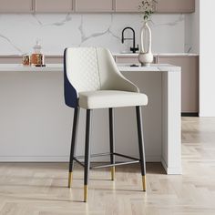 a white and blue bar stool sitting in front of a counter