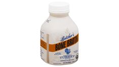 a bottle of bone broth on a white background