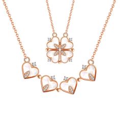 three heart shaped necklaces with diamonds on the bottom and two hearts in the middle