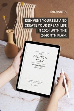 a person holding an ipad with the text, reinvent yourself and create your dream life in 20 - 24 months plan