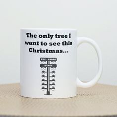 a white coffee mug with the words, the only tree i want to see this christmas