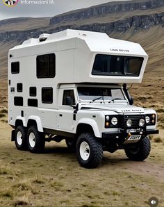 an off road vehicle with a camper on the back