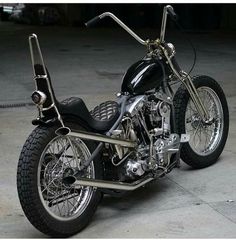 a black motorcycle parked in a parking garage