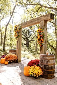 an outdoor ceremony with sunflowers and pumpkins