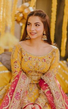 a woman in a yellow and red outfit