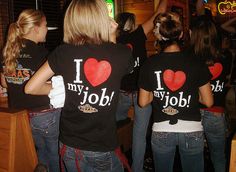 three women in black shirts with i love my job t - shirts on their backs