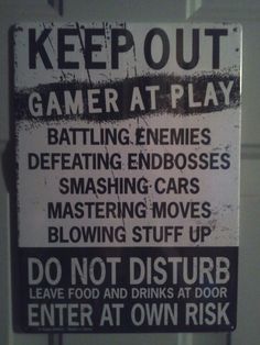 a sign that is on the side of a door saying to keep out gamer at play