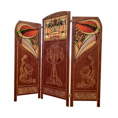 a wooden room divider with stained glass panels on the top and bottom panel,