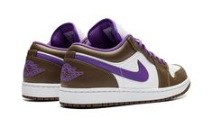 The Air Jordan 1 Low “Purple/Mocha” is a colorway of the low-top retro basketball shoe with a unique appearance.  Keeping things clean and versatile, the shoe is equipped with a white leather base that gives way to contrasting Palomino (brown) leather overlays.  A purple leather Swoosh is found on either side of the shoe.  Purple “Wings” branding is embroidered on the heel.  Underfoot, a white rubber midsole and brown rubber outsole complete the look.  Release date: March 1, 2023 Air Jordan 1 Low Purple, Mocha Shoes, Jordan 1 Low Purple, Shoe Purple, Nike Jordan 1 Low, Purple Wings, Nike Brown, Retro Basketball Shoes, Nike Air Jordan 1 Low