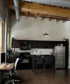 the kitchen is clean and ready to be used as a dining room or office space