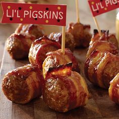 bacon wrapped pretzels with little pigskin's sign on them and dipping sauce