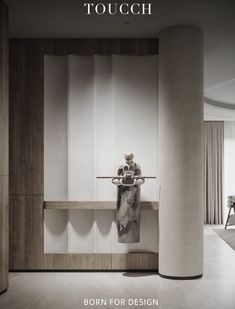 a person sitting on a bench in the middle of a room with columns and tables