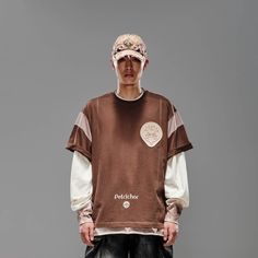 The Deconstructed Patchwork Jersey seamlessly blends street style with athletic aesthetics. Featuring a bold color-block patchwork design, this jersey stands out with its unique look. The left chest sports a branded badge, while the front hem is printed with "Petrichor" and the brand logo. The back is adorned with a thorny leaf patch, adding an extra layer of detail. Made from premium 100% cotton fabric, this jersey ensures both comfort and durability. The oversized fit provides a relaxed, moder Sporty Cotton T-shirt With Patchwork, Sporty Cotton T-shirt With Patchwork Details, Sporty Patchwork Cotton T-shirt, Cotton Patchwork Top For Streetwear, Patchwork Cotton Tops For Streetwear, College Crew Neck Patchwork Sweatshirt, Sporty Patchwork Tops For College, Relaxed Fit Patchwork Top For Streetwear, Casual Patchwork Tops For Sports