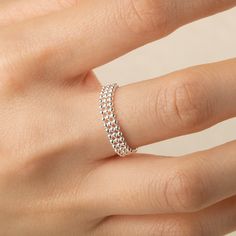 This adjustable chain ring is a delicate and refined piece, offering the perfect balance of elegance and versatility. The design allows for subtle adjustments, ensuring a comfortable fit on any finger, while the shimmering silver catches the light, adding a touch of sparkle to your hand. Its timeless design is suitable for both casual and formal occasions, and its lightweight structure promises all-day comfort. Materials:  s925 Sterling silver  Cyan Art Store creates dainty jewelry that is inspired by antique and tribal designs from around the globe.   All of our pieces are handmade so keep in mind that the final product might deviate slightly from the pictured product. Silver Dainty Rings With Adjustable Chain, Adjustable Minimalist Open Chain Ring, Delicate Rings With Adjustable Chain, Adjustable Sterling Silver Dainty Chain Ring, Adjustable Dainty Sterling Silver Chain Ring, Dainty Silver Open Chain Ring, Dainty Stackable Chain Ring, Silver Minimalist Chain Ring For Wedding, Minimalist Silver Chain Ring For Wedding