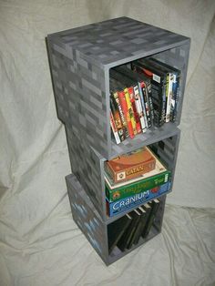 a stack of books sitting on top of a book shelf